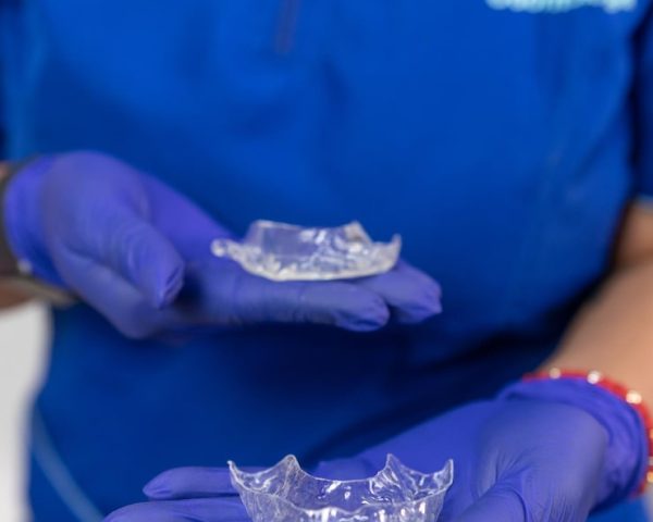 closeup-dentist-holding-retainer-oral-treatment-her-office_833319-282